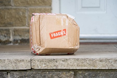 Damaged_fragile_parcel_delivered_to_doorstep